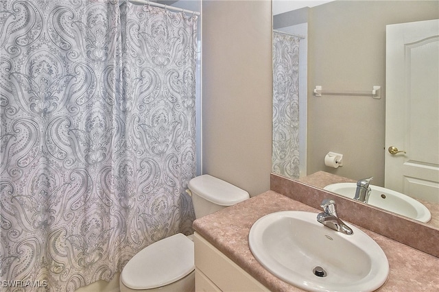 8681 Athena Ct, Lehigh Acres, FL 33971 - full bath featuring toilet, vanity, and curtained shower
