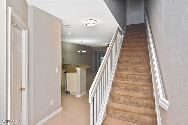 8681 Athena Ct, Lehigh Acres, FL 33971 - stairway with tile patterned flooring, baseboards, a chandelier, and recessed lighting
