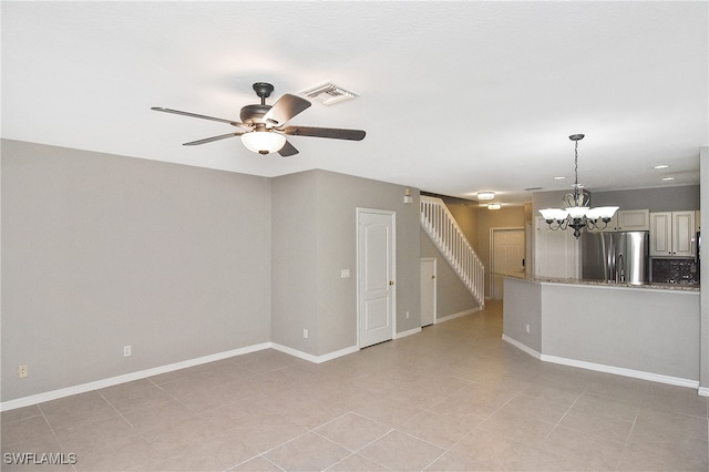 8681 Athena Ct, Lehigh Acres, FL 33971 - unfurnished living room featuring a ceiling fan, a chandelier, stairway, baseboards, and recessed lighting