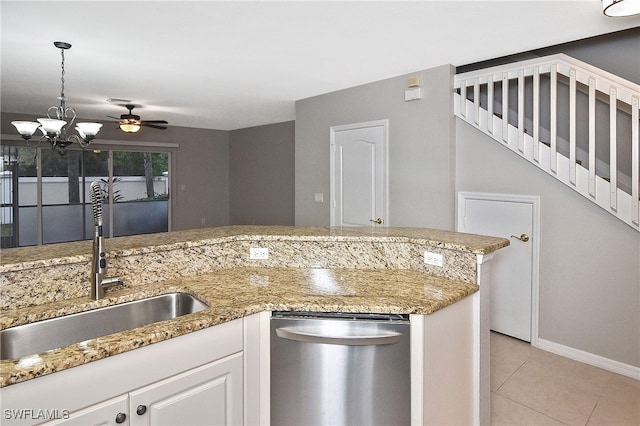 8681 Athena Ct, Lehigh Acres, FL 33971 - kitchen with dishwasher, a sink, light tile patterned floors, hanging light fixtures, and a chandelier