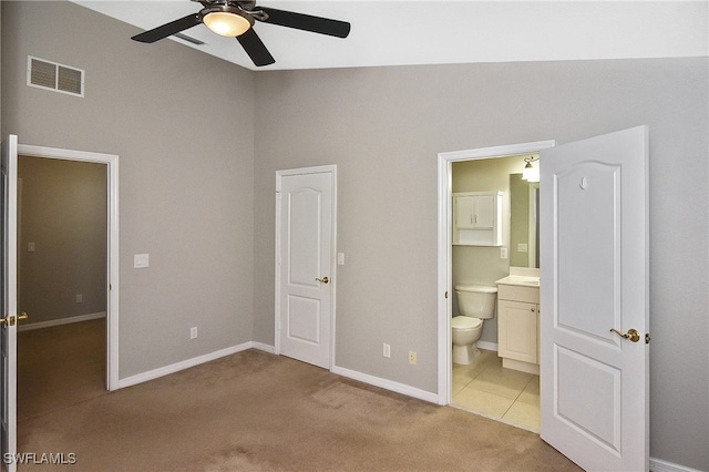 8681 Athena Ct, Lehigh Acres, FL 33971 - unfurnished bedroom featuring light colored carpet, baseboards, ensuite bath, and a ceiling fan