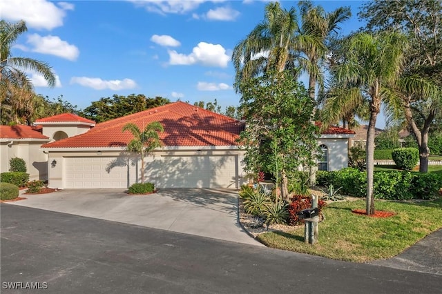 mediterranean / spanish home featuring a garage