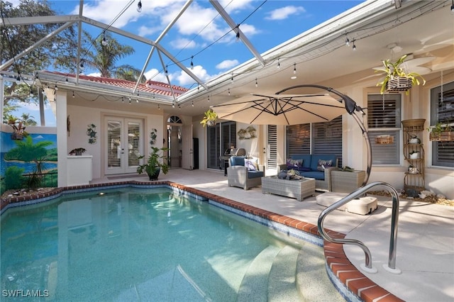 view of swimming pool with a lanai, french doors, an outdoor hangout area, and a patio