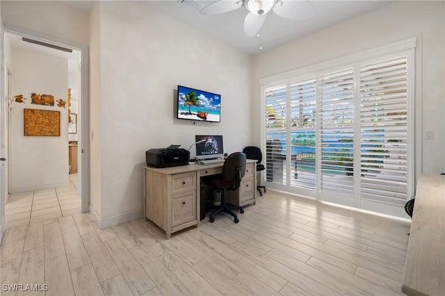 office space featuring ceiling fan and light hardwood / wood-style flooring