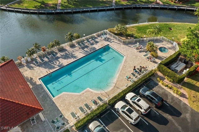 birds eye view of property with a water view