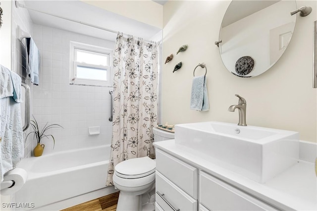 full bathroom featuring toilet, vanity, wood-type flooring, and shower / bathtub combination with curtain