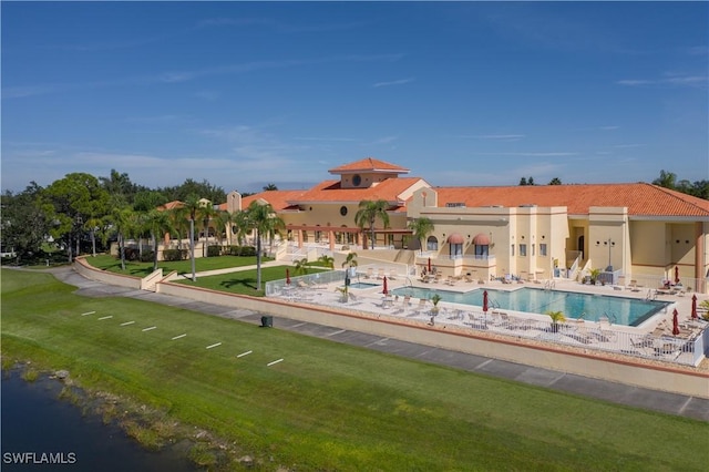 view of pool featuring a patio area and a lawn