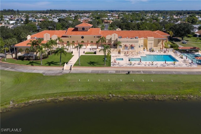 birds eye view of property with a water view