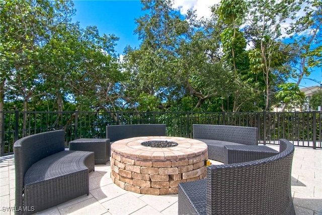 view of patio / terrace featuring an outdoor living space with a fire pit