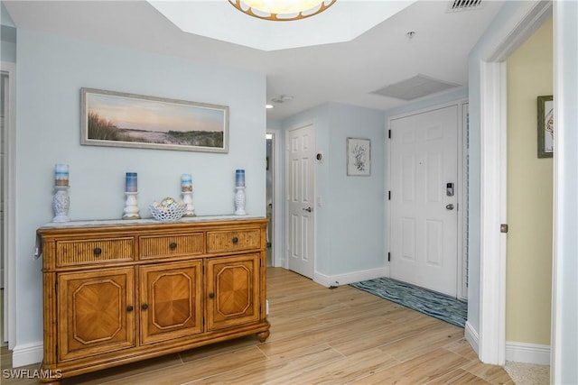 foyer entrance with light wood-type flooring