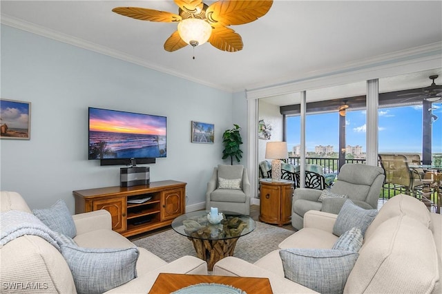 living room featuring ceiling fan and ornamental molding