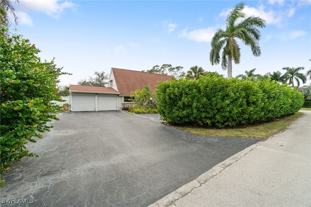 view of side of property with a garage