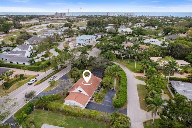 birds eye view of property featuring a water view