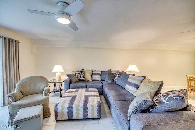 tiled living room featuring ceiling fan