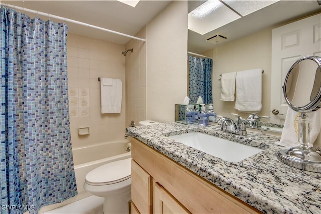 full bathroom with toilet, shower / bath combination with curtain, and vanity