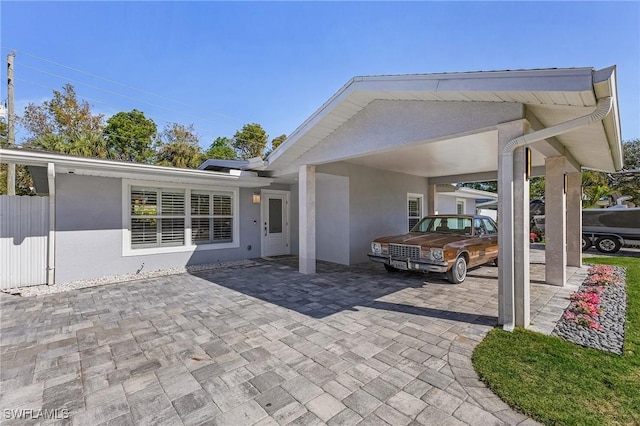 view of patio / terrace with a carport