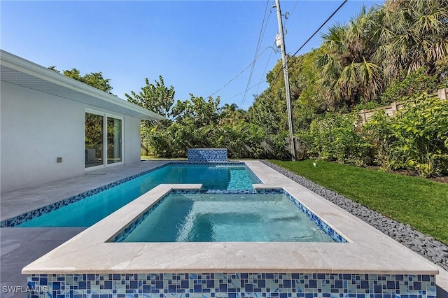 view of swimming pool featuring an in ground hot tub