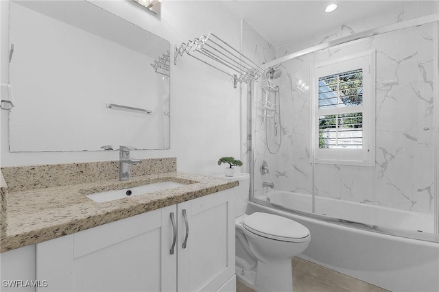 full bathroom featuring enclosed tub / shower combo, vanity, and toilet