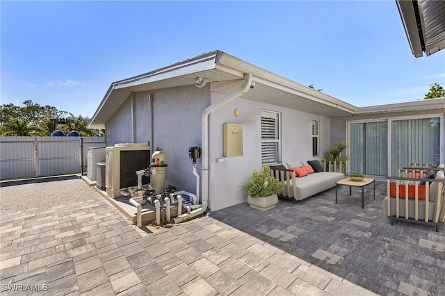 rear view of property featuring a patio area