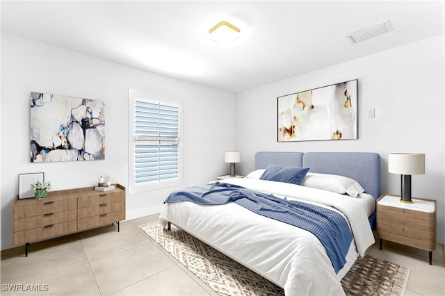 bedroom featuring light tile patterned floors