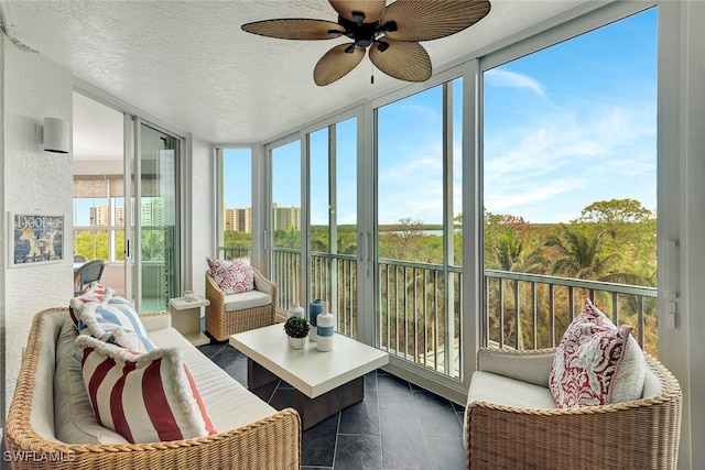 sunroom featuring ceiling fan