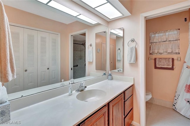 bathroom with tile patterned floors, vanity, and toilet