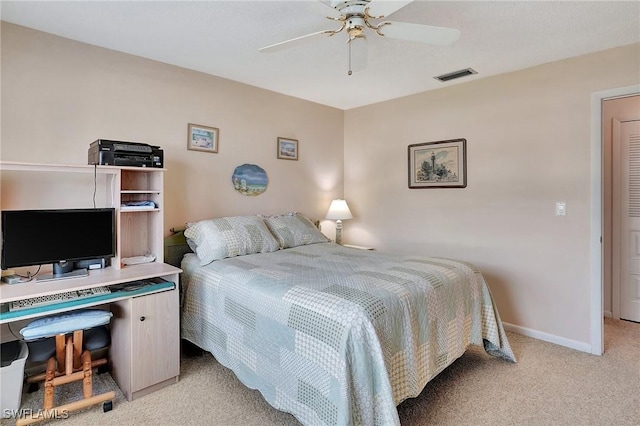 carpeted bedroom with ceiling fan