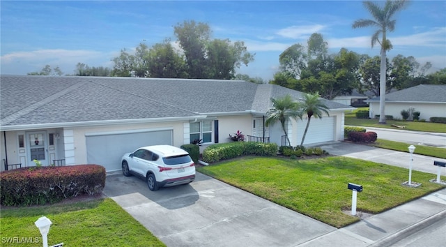 single story home with a garage and a front yard