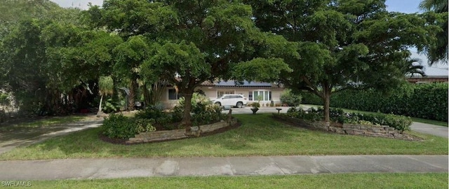 view of front of home with a front lawn