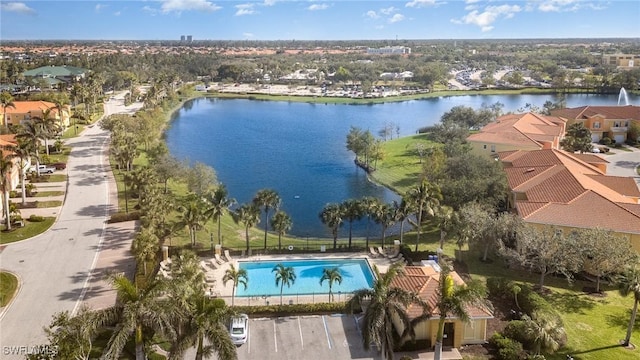 drone / aerial view featuring a residential view and a water view