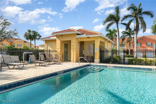 view of swimming pool with a patio area