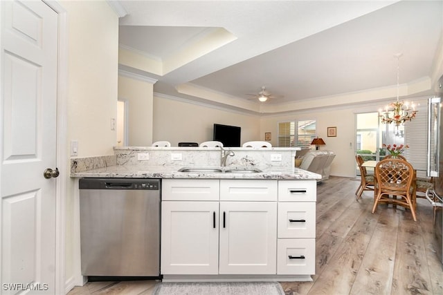 kitchen with dishwasher, kitchen peninsula, sink, white cabinetry, and ceiling fan with notable chandelier