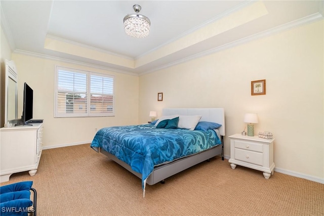 carpeted bedroom with crown molding, a tray ceiling, and a notable chandelier