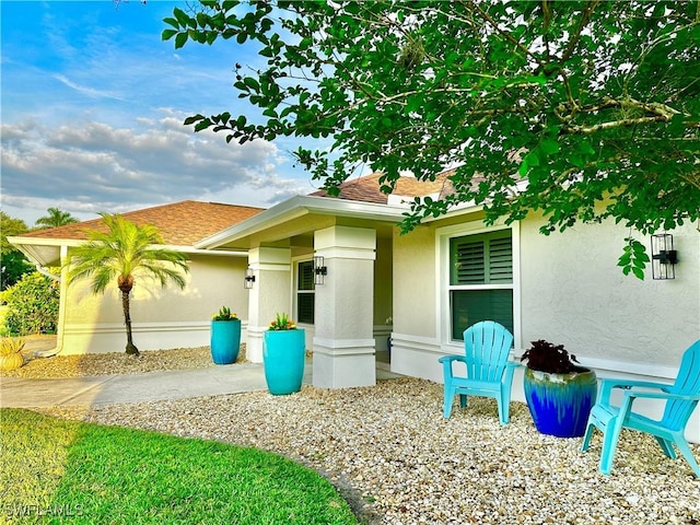 9553 Campbell Cir, Naples, FL 34109 - exterior space with a shingled roof and stucco siding