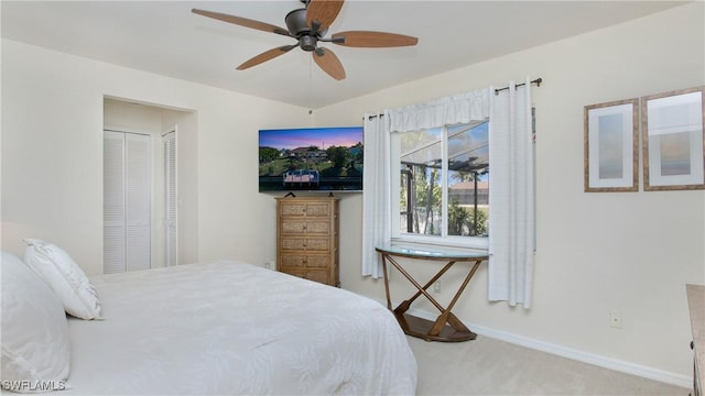 bedroom with carpet, ceiling fan, and a closet