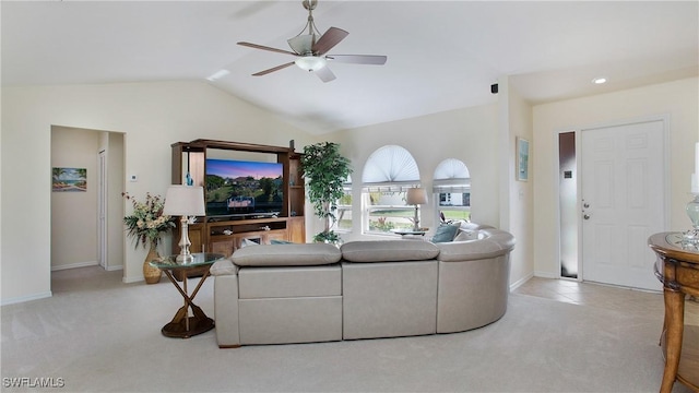 carpeted living room with lofted ceiling and ceiling fan