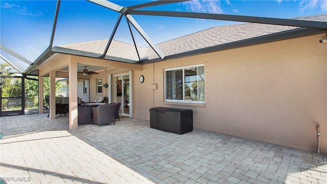 view of patio with a lanai and ceiling fan