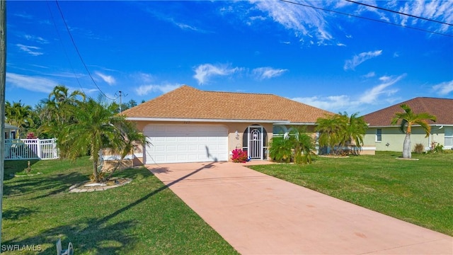 ranch-style house featuring a garage and a front lawn