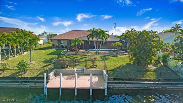 exterior space with a water view and a yard