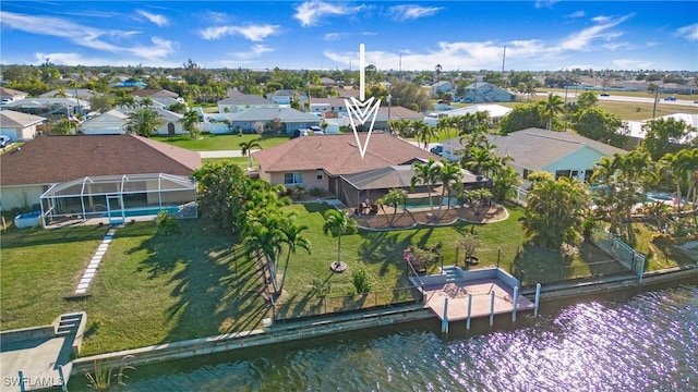 birds eye view of property with a water view