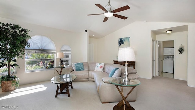 living room featuring washer / dryer, light carpet, lofted ceiling, and ceiling fan