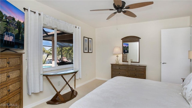 bedroom with light carpet and ceiling fan