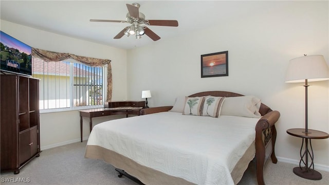 bedroom featuring light carpet and ceiling fan