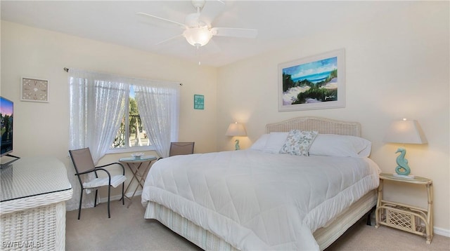 bedroom featuring ceiling fan and light colored carpet