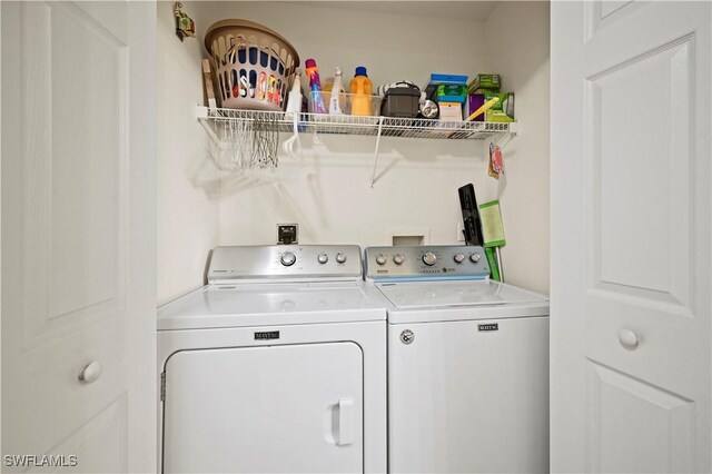 clothes washing area featuring washing machine and dryer