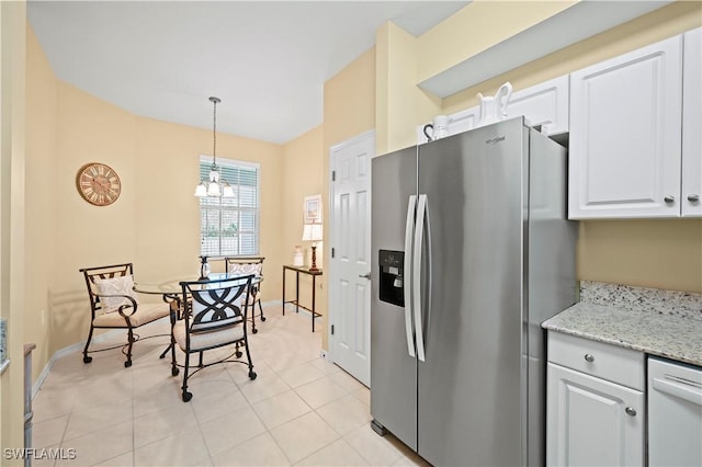 kitchen featuring white cabinetry, dishwasher, light tile patterned floors, stainless steel refrigerator with ice dispenser, and pendant lighting