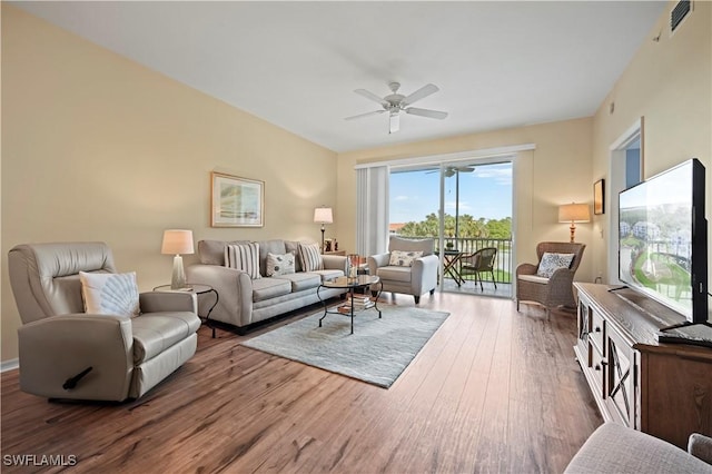 living room featuring ceiling fan and wood finished floors