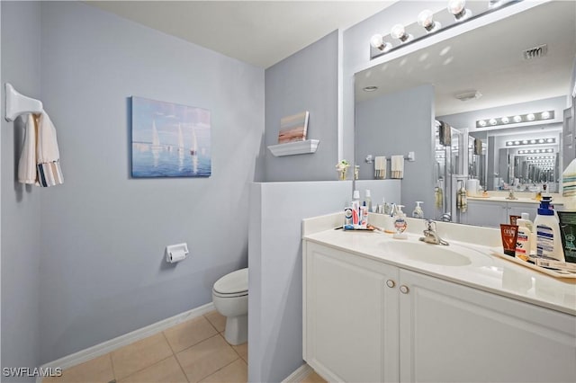 full bathroom with toilet, tile patterned flooring, baseboards, and vanity