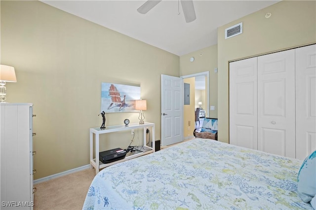 bedroom featuring carpet flooring, baseboards, a closet, a ceiling fan, and electric panel