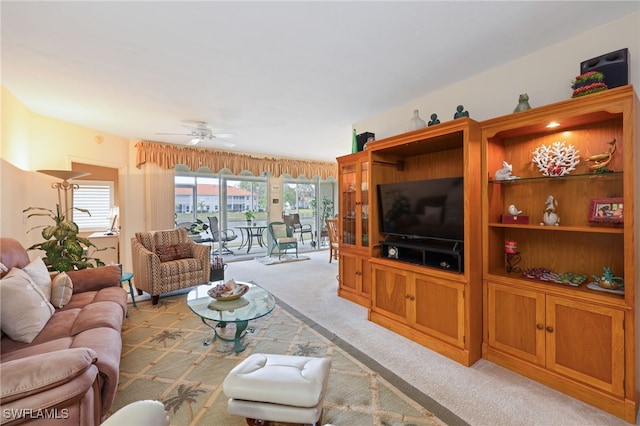 living room featuring ceiling fan and light colored carpet